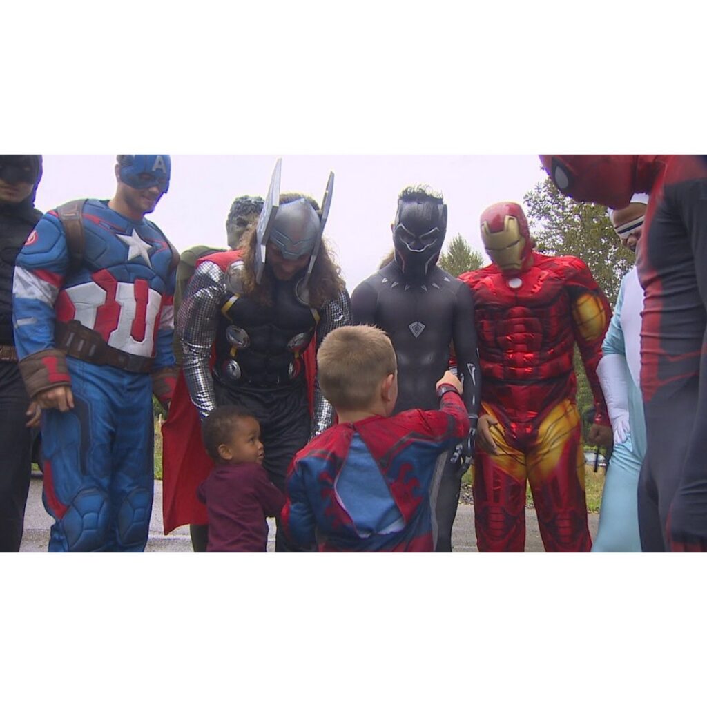High School Football Players Surprise Birthday Boy Dressed as Superheroes